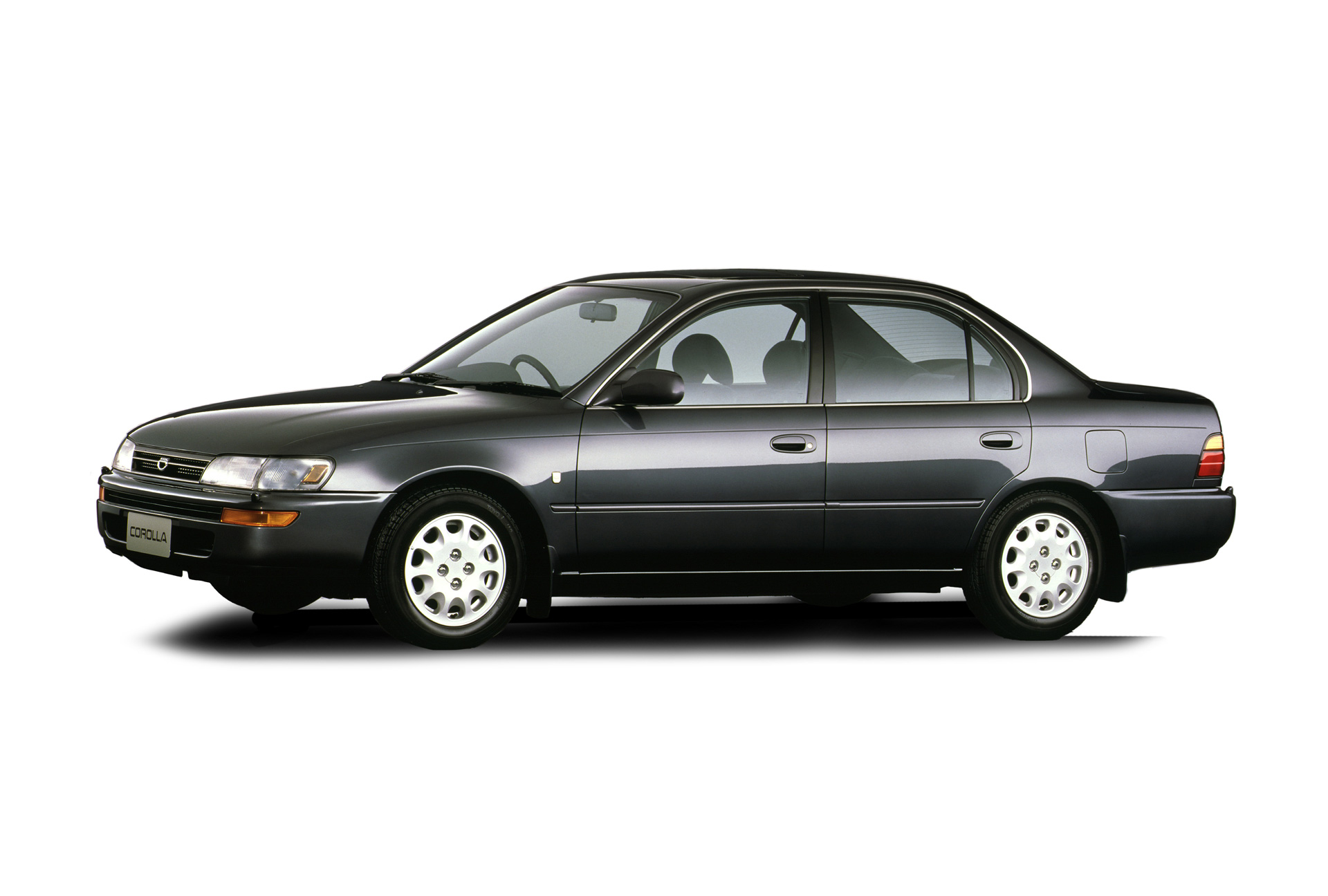 Mørk Toyota Corolla sedan fra begyndelsen af 1990'erne.