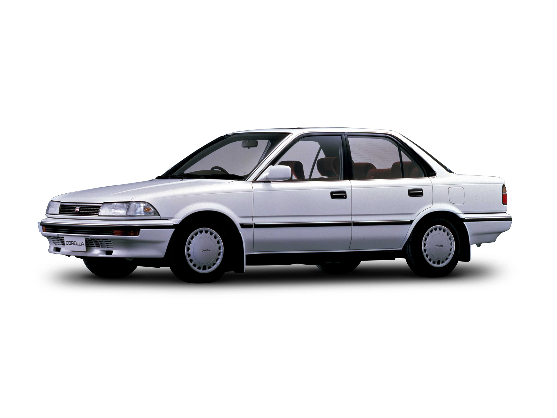 Lys Toyota Corolla sedan fra slutningen af 1980'erne.